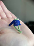 Mini crochet frog in a blue sweter